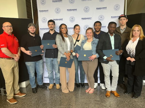 EMT students pose with their instructors, Donald Tebeau & Laurie White, at their recognition ceremony.
