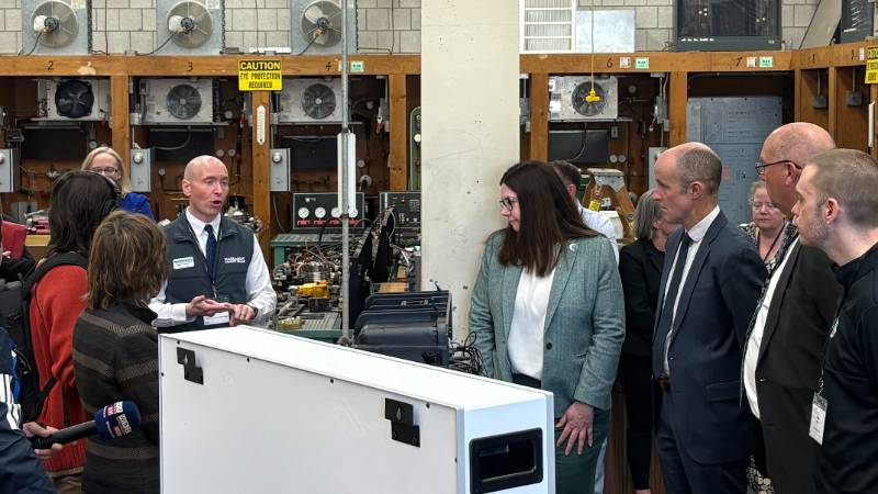 Massasoit employees leading a group tour of the College's HVAC lab in Canton.