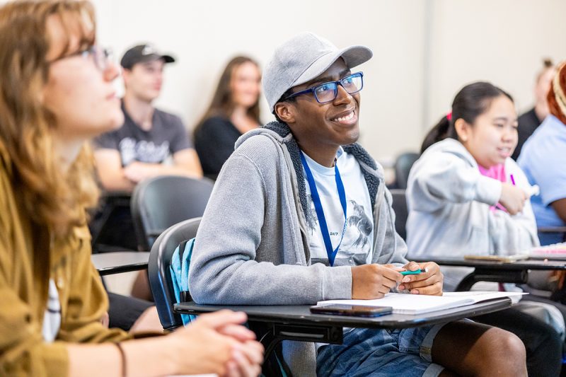 Students sitting in desks in a classroom.