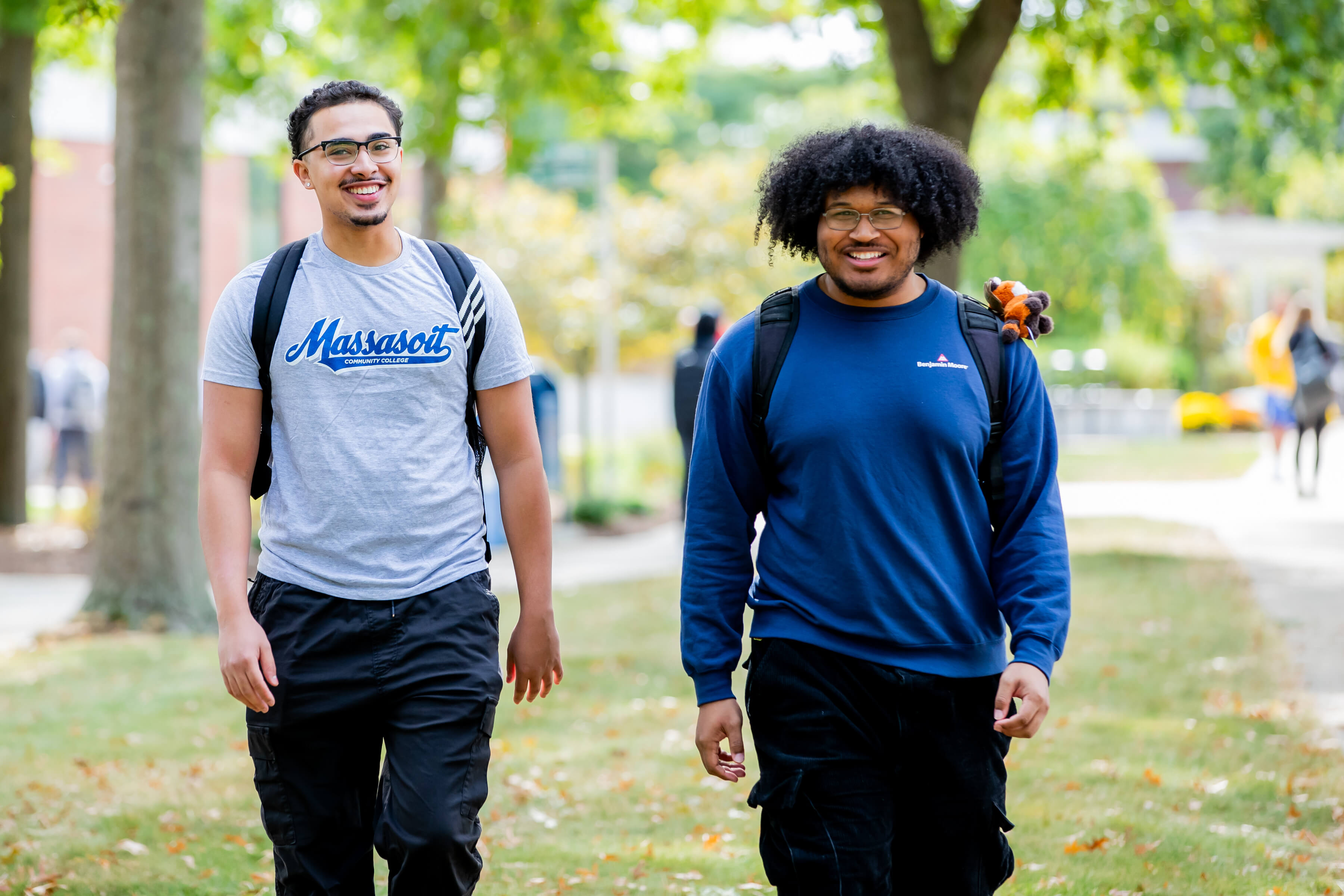 Two students walking on campus.