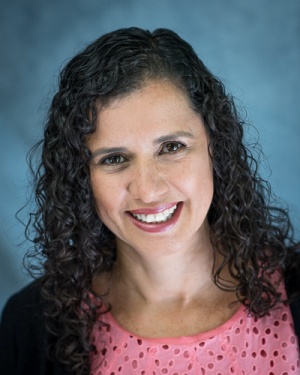 Joia Souza Dacaret headshot.