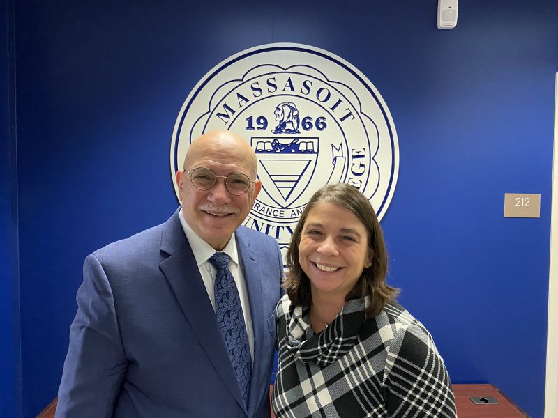 President DiPasquale with Dean Ruggieri standing in front of the College seal.