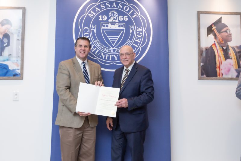 Brockton Mayor Robert Sullivan presenting a City proclamation to Massasoit Community College President Ray DiPasquale in recognition of the ribbon cutting for Massasoit Downtown Brockton Location at 230 Main Street on Tuesday, November 28, 2023. 