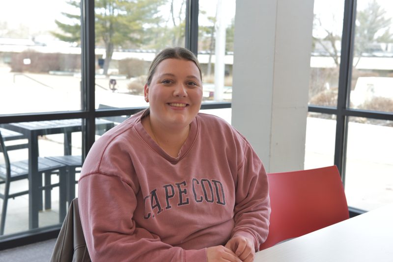 Photo of student smiling in the Sudent Center Dining Commons.