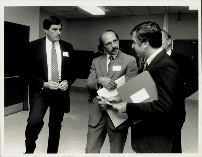 Massasoit Community College President Ray DiPasquale (center), then an administrator at Springfield Technical Community College, with then STCC President Dr. Andrew M. Scibelli (left) and then-Governor Michael Dukakis (right) in 1985. Photo credit: Don Treeger.