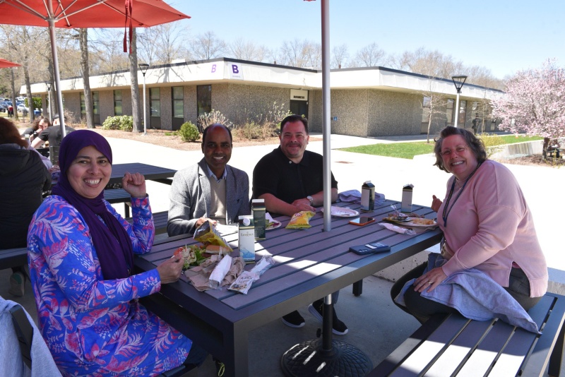 Faculty and staff eating lunch at the all-college bbq.