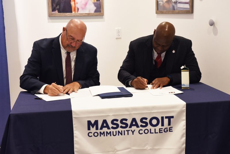 Massasoit Interim President Mitchell and Commissioner of Probation Ifill seated together to sign an MOU at the Future of Work Open House in Downtown Brockton on Nov. 14, 2024.