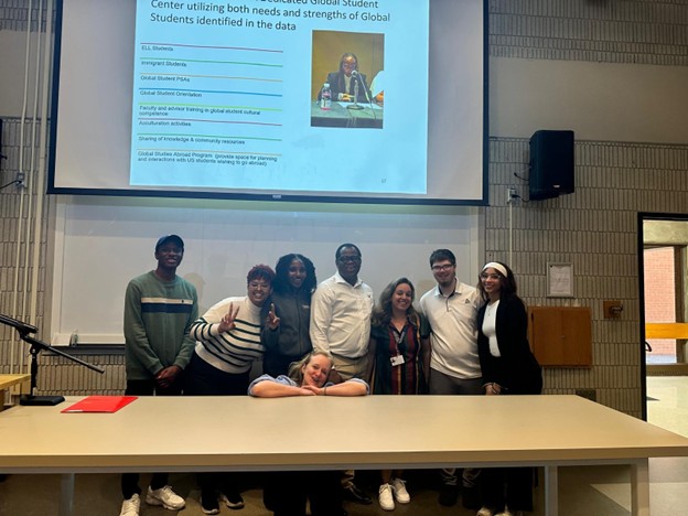 Group of students presenting at a conference.