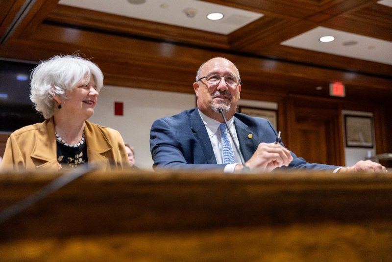 Massasoit President Bill Mitchell (right) testifying at a hearing of the Joint Committee on Higher Education.