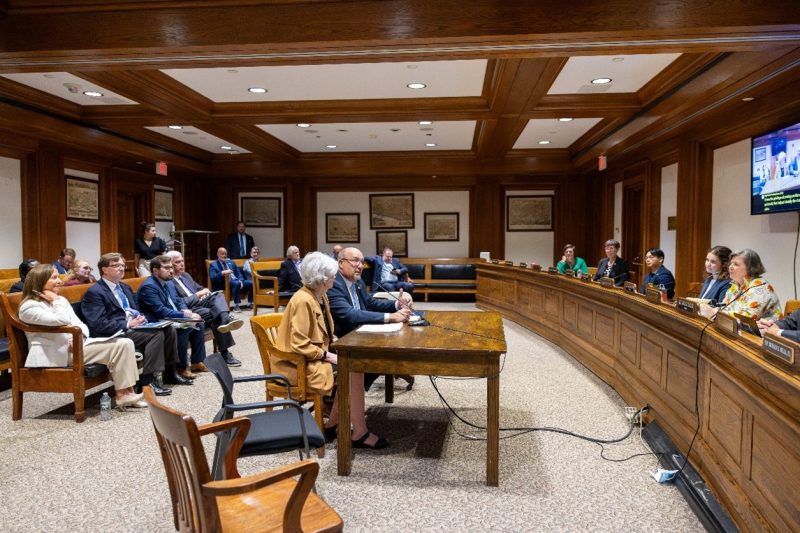 Massasoit President Bill Mitchell (center) testifies in favor of the BRIGHT Act at a hearing of the Joint Committee on Higher Education.