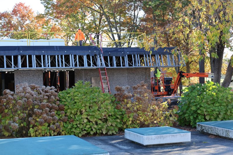 Workers on top of Massasoit's new Science Building