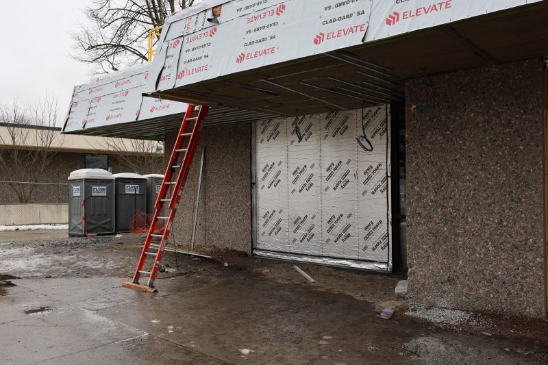 Wall opening of the new Science building with temporary barriers.